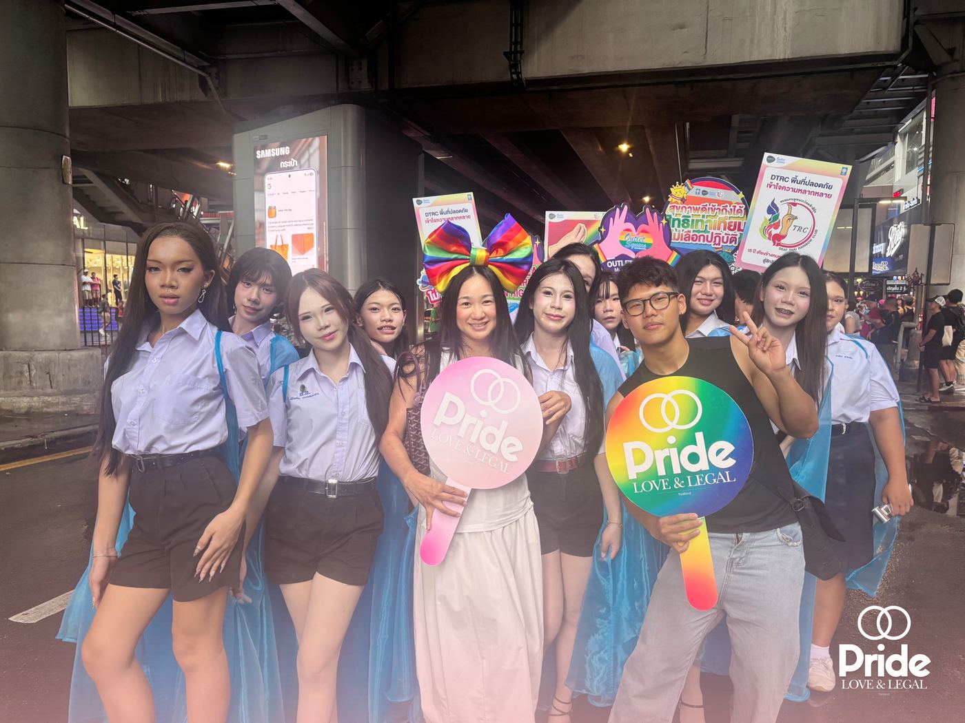 The Pride Legal team with the firm's heart signs at the Pride parade in Bangkok
