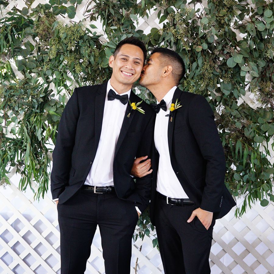 Two grooms in formal wear on their wedding day