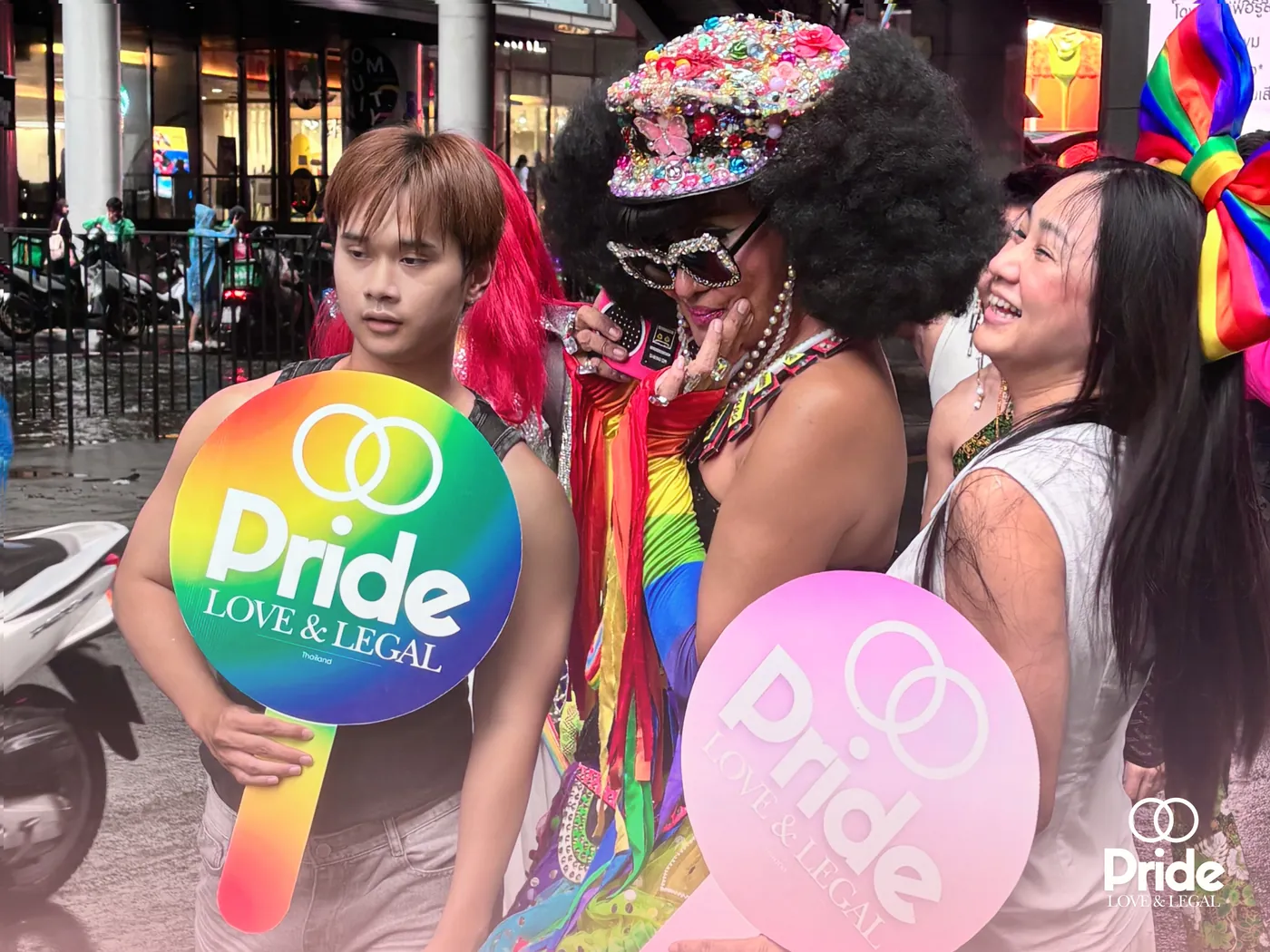 Pride Legal team with rainbow signs at a Pride street parade